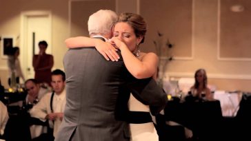 Photo of Andrea dancing with her grandfather.