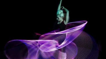 Photo of Lisa Lottie performing with an LED hula hoop.