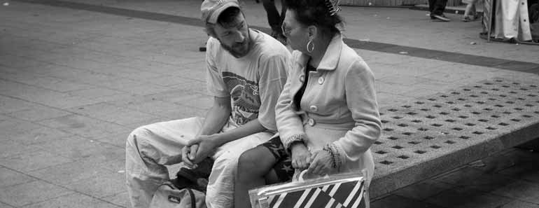 Photo of two people having a conversation. Two people in conversation. Image credit: Frank Lindecke / Flickr / CC.