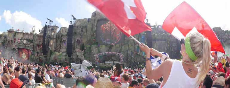Photo of a crowd listening to music at the Tomorrowland EDM concert.